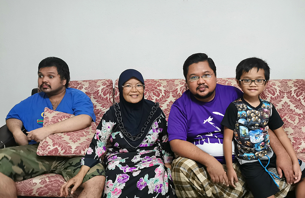 Mdm Serwati with her sons and grandson