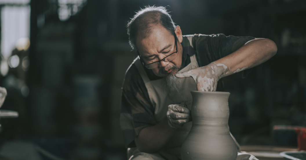 Senior making pottery