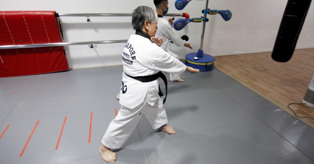 senior doing taekwondo senior doing taekwondo