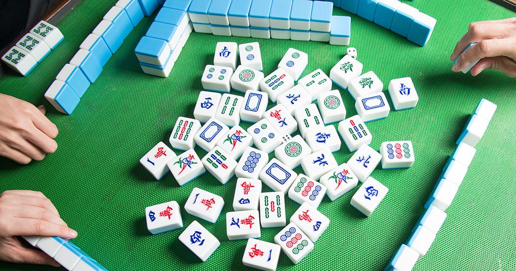Seniors play board games with friends Seniors play board games with friends