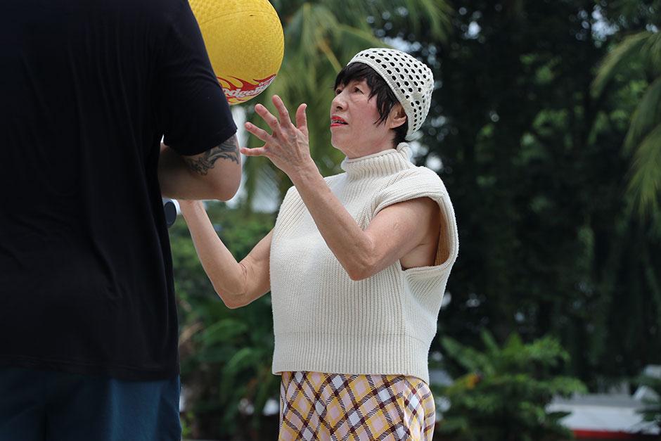 senior in singapore playing flippa ball